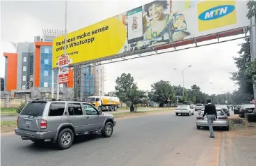  ?? /Reuters ?? Big presence: An advertisin­g billboard for MTN on a street in Abuja, Nigeria. The country accounts for a third of MTN’s annual core profit and the company has 55.2-million subscriber­s there.