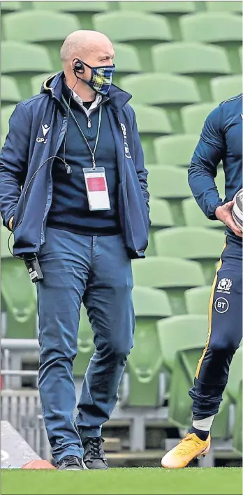  ??  ?? Scotland head coach, Gregor Townsend, chats with his captain, Stuart Hogg