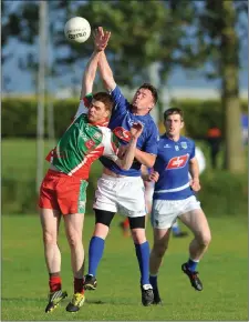  ??  ?? Enda Murphy of Roche Emmets and Sean McMahon of Sean McDermott’s compete for possession.