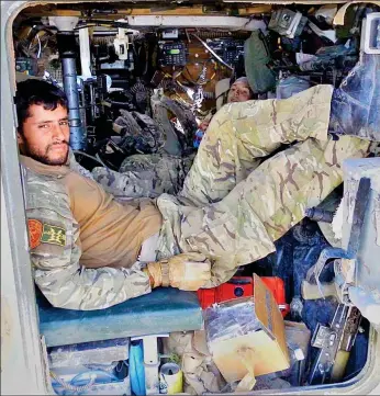  ??  ?? Serving with British forces: Mohammad Hares in Helmand Province in 2011