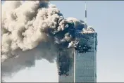  ?? AJC 2001 ?? Smoke pours from the World Trade Center in New York City after the twin towers were hit by two hijacked jets Sept. 11, 2001.