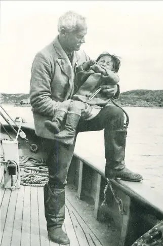  ??  ?? Sir Wilfred Grenfell cares for a child on board his hospital ship in Labrador.