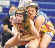  ?? KINTZEL | THE MORNING CALL ?? Easton’s Rachel DeGiulio, front, finished second at 140 pounds at Sunday’s girls state wrestling tournament at Spooky Nook in Manheim. RICK