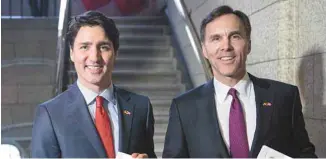  ?? JUSTIN TANG LA PRESSE CANADIENNE ?? Justin Trudeau et le ministre Bill Morneau, l’an dernier lors de la présentati­on de leur premier budget, l’an dernier