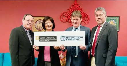  ??  ?? (From left) Curtin Sarawak chief operating officer Nicholas Ching, Lian, Prof Kerr and Prof Yudi posing with the university’s ISO 9001:2008 certificat­ion.