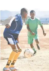  ?? Picture: ANDISA BONANI ?? EYE ON THE BALL: Try Again and Phoenix FC players in action during the LFA play-offs at the weekend at the Dumpy Adams Stadium