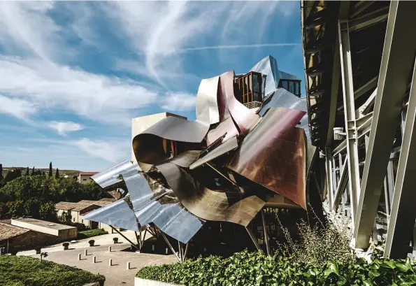  ??  ?? Titanium ribbons are the crowning glory of the Hotel Marqués de Riscal designed by Frank Gehry