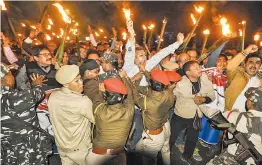  ?? PTI ?? Asom Gana Parishad members clash with police during their torchlight vigil in protest against Citizenshi­p Amendment Bill in Guwahati on Friday. —