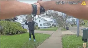  ?? AKRON POLICE BODY CAMERA FOOTAGE ?? Akron police officer Ryan Westlake confronts Tavion Koonce-Williams, who was carrying a fake gun on April 1. Westlake shot Tavion in the wrist.