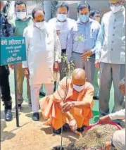  ?? SOURCED ?? Chief minister Yogi Adityanath planting a sapling at his residence in Lucknow on World Environmen­t Day.