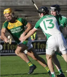  ??  ?? Peter Atkinson of HWH-Bunclody flicks the ball away from Cloughbawn’s first-half goalscorer, M.J. Furlong.