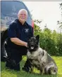  ?? MEDIANEWS GROUP FILE PHOTO ?? Chester County Sheriff’s Deputy Lt. Harry McKinney, with his K-9 Afta, in a file photo. McKinney is accused of inflating overtime requests in the county as compensati­on for his care of the K-9s he maintains.