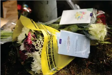  ??  ?? Tributes and flowers to Ronnie Patterson, 38, were left outside his house in Wellhouse