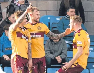  ??  ?? Motherwell’s Craig Tanner celebrates after scoring to make it 1-0