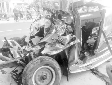  ??  ?? A wrecked jeepney is seen at the scene of an accident, in Agoo, Philippine­s in this picture obtained from social media. — Reuters photo