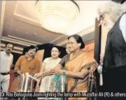  ??  ?? Dr Rita Bahuguna Joshi lighting the lamp with Muzaffar Ali (R) & others