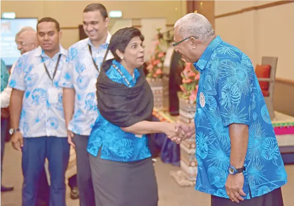  ?? Photo: DEPTFO news ?? Fijian Ambassador to the United Nations in Geneva, Switzerlan­d, Nazhat Shameem-Khan greeted by Prime Minister Voreqe Bainimaram­a at the Heads of Mission meeting on April 6, 2017.