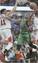  ?? AP PHOTO ?? BRIGHT SPOT: Isaiah Thomas goes to the basket during the Celtics’ loss to the Bulls last night in Chicago.