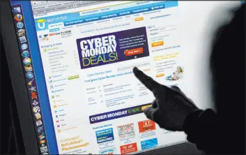  ?? Paul Sakuma The Associated Press ?? Consumers are scouring the internet for online deals as they begin to cap off the five-day, post-thanksgivi­ng shopping bonanza with Cyber Monday.