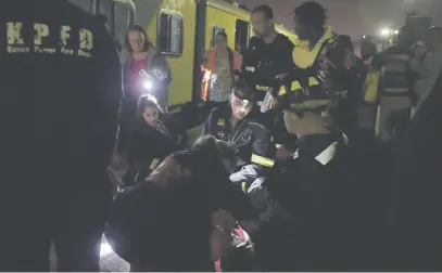  ?? Picture: Neil McCartney ?? FIRST AID. Emergency personnel attend to injured passengers at the Van Riebeeck station in Kempton Park last night. There were no reported fatalities.