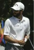  ?? CHARLIE RIEDEL/THE ASSOCIATED PRESS ?? Adam Hadwin sits at eight over par in his Masters debut: “I’m really fighting things right now.”