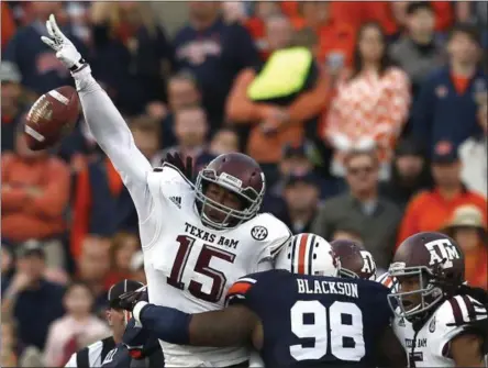  ?? BUTCH DILL — THE ASSOCIATED PRESS FILE ?? In this Nov. 8, 2014photo, Texas A&amp;M defensive lineman Myles Garrett (15) blocks a field goal attempt by Auburn at the end of the first half of an NCAA college football game in Auburn, Ala.