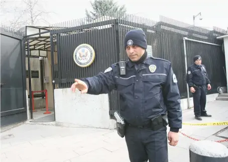  ?? AFP/File ?? Turkish police officers patrol near the side entrance of the US Embassy in Ankara. Security at the US missions in Turkey has been tightened recently.