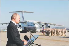  ?? AP PHOTO ?? Russian President Vladimir Putin addresses the troops at the Hemeimeem air base in Syria. Several private Russian military contractor­s were killed by a U.S. strike in Syria, Russian media has reported.