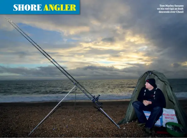  ??  ?? Tom Marley focuses on his rod tips as dusk descends over Chesil