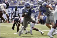  ?? BRANDON DILL — THE ASSOCIATED PRESS FILE ?? In this file photo, Memphis running back Kenneth Gainwell (19) carries the ball in the first half of an NCAA college football game against Mississipp­i, in Memphis, Tenn. Gainwell has run for 620 yards and averages 124 yards rushing per game to rank sixth among all Football Bowl Subdivisio­n players. Memphis takes on Temple in Philadelph­ia on Saturday. Temple ranks second among all FBS teams in red-zone defense and fourth in third-down conversion percentage defense.