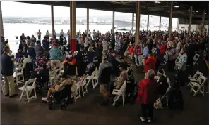  ?? (AP/Marco Garcia) ?? People attend a ceremony Tuesday on the 80th Pearl Harbor attack anniversar­y at Joint Base Pearl Harbor-Hickam in Honolulu.