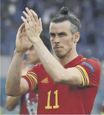  ??  ?? 0
Gareth Bale applauds the Wales supporters after the game in Rome’s Stadio Olimpico