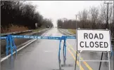  ?? ASHLEY RUEFF/CHICAGO TRIBUNE ?? Wolf Road at 143rd Street closed during flooding in 2018.