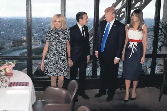  ?? Picture / AP ?? Lunch at the Eiffel Tower came with a serving of controvers­y for ( from left) Brigitte Trogneux, Emmanuel Macron, Donald Trump and Melania Trump met in paris.