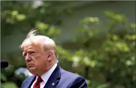  ?? (AP Photo/Evan Vucci, File) ?? President Donald Trump speaks during an event on police reform on June 16 in the Rose Garden of the White House in Washington. Americans are deeply unhappy about the state of their country, and a majority think Trump is doing more to divide the nation than unite it, according to a new poll from The Associated Press-NORC Center for Public Affairs Research.