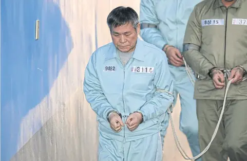  ?? AFP ?? South Korean pastor Lee Jaerock arrives at the Seoul Central District Court to attend his trial. The cult leader was convicted of the multiple rape of female followers.