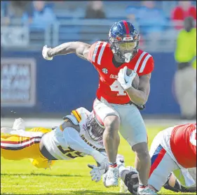  ?? Thomas Graning The Associated Press ?? Mississipp­i running back Quinshon Judkins, who leads the SEC with 14 rushing touchdowns, is 67 yards shy of a second consecutiv­e 1,000-yard season.