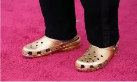  ?? Photograph: Chris Pizzello/AFP/Getty Images ?? Questlove arrives at the Oscars on Sunday in a pair of gold crocs.