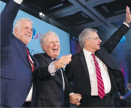  ?? JACQUES BOISSINOT/THE CANADIAN PRESS ?? Quebec Premier Philippe Couillard, left, former premier Jean Charest and Liberal minister Jean-Marc Fournier at the 150th anniversar­y celebratio­ns of the Quebec Liberal Party Saturday in Quebec City. Charest spoke to the party for the first time since...