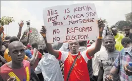  ?? Sayyid Abdul Azim ?? The Associated Press Supporters of Raila Odinga’s National Super Alliance demonstrat­e Wednesday in Nairobi, Kenya. The protesters are demanding a change in leadership at the country’s election commission.