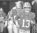  ?? CHRISTIAN PETERSEN/GETTY IMAGES ?? The 49ers’ Brock Purdy takes the field prior to a game against the Arizona Cardinals at State Farm Stadium on Dec. 17, 2023, in Glendale, Arizona.