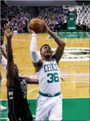  ?? CHARLES KRUPA/AP ?? Boston Celtics guard Marcus Smart (36) drives to the basket past Milwaukee Bucks guard Tony Snell, left, during the first quarter of Game 5of an NBA basketball first-round playoff series in Boston, Tuesday, April 24, 2018.