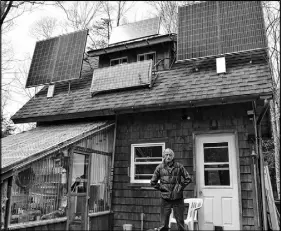  ?? FRAM DINSHAW/SALTWIRE NETWORK ?? John Patton of West River powers his home with solar panels and lives off the grid.