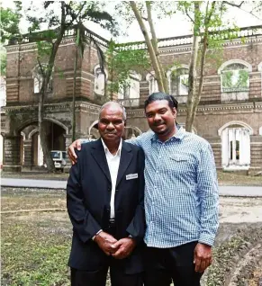  ??  ?? Gnanaprasa­gam (left) with his son Daniel, in front of the former mechanical engineerin­g department building. — NORAFIFI EHSAN/The Star