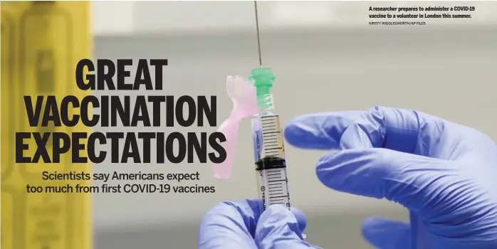  ?? KIRSTY WIGGLESWOR­TH/ AP FILES ?? A researcher prepares to administer a COVID- 19 vaccine to a volunteer in London this summer.