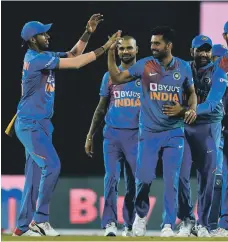  ?? AFP ?? Deepak Chahar, second right, celebrates after taking the wicket of Bangladesh batsman Mustafizur Rahman