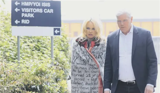  ?? PICTURE: PA ?? 0 Pamela Anderson leaves Belmarsh Prison in south-east London, accompanie­d by Wikileaks editor Kristinn Hrafnsson