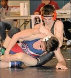  ??  ?? Pennsbury senior Jason Bing (background) finished third, thanks to a 2-1 win over Lenape Valley’s Peter Lipari in this year’s Escape the Rock wrestling tournament held Jan. 19 and 20 at Council Rock South.