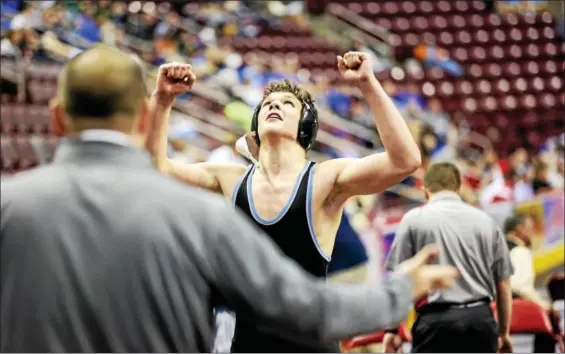  ?? NATE HECKENBERG­ER — FOR DIGITAL FIRST MEDIA ?? Daniel Boone’s Jesse Enck reacts after scoring a last-second win to clinch a medal at 220 pounds during the PIAA Championsh­ips last winter.