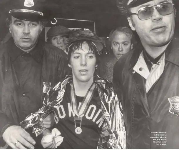  ??  ?? Benoit is escorted
to the dressing room after winning the 1979 Boston Marathon at her
first attempt